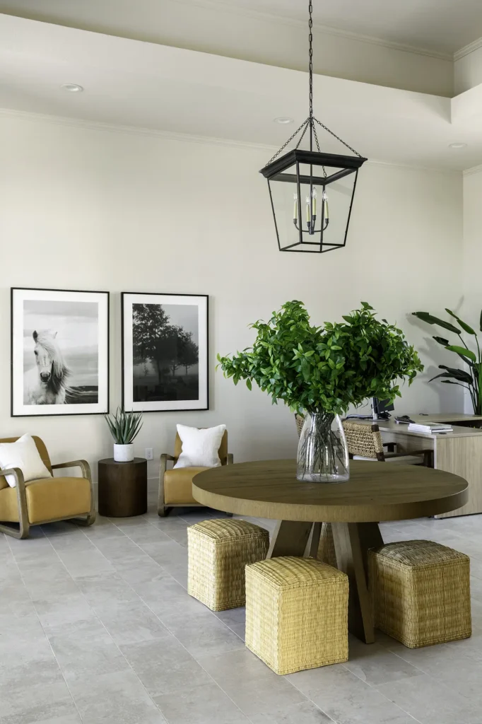 Leasing office lobby with arm chairs and tables