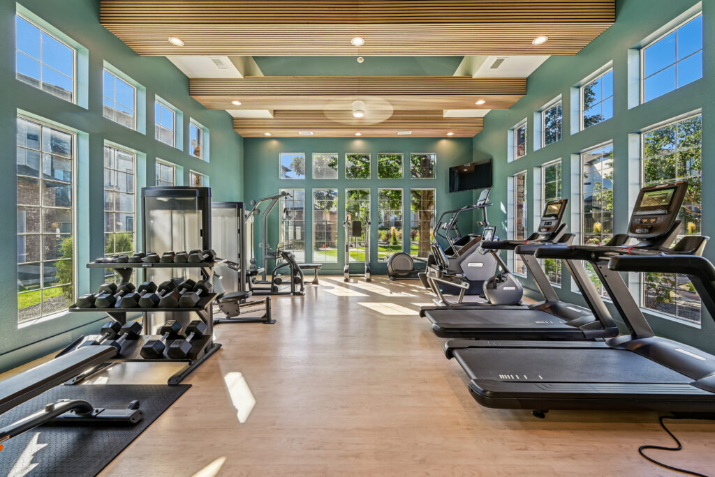 Fitness center with free weights and treadmills